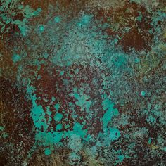 an old rusted metal surface with green paint