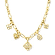 The Lacie Statement Charm Necklace will have you charmed, we're sure. An adorable assortment of sweet hearts and medallion shapes inspired by the Kendra Scott logo, this playful necklace is a contemporary take on a nostalgic jewelry trend. To preserve your fashion jewelry for years to come, agents such as soaps, perfumes, lotions, makeup, hair and cleaning products, and other chemical contact should be avoided. Take care to remove jewelry before showering, sleeping, exercising or swimming. Kendr Chunky Charm Necklace, Nostalgic Jewelry, La Jewelry, Necklace Kendra Scott, Senior Szn, Customized Necklace, Xmas Wishlist, Zodiac Pendant Necklace, Sweet Hearts