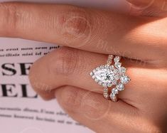 a close up of a person's hand with a ring on top of their finger