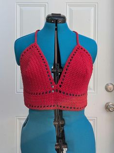 Large handmade crochet top with lace-up back in red. 100% cotton. Measurements: Bottom Band  Length - 28 " Bottom Band Height - 3" Cup Height (excluding bottom band) - 8" Cup Width (each) - 8.5" For best care, hand wash or machine wash with cold water in delicates bag on a gentle cycle and lay flat to dry. Made from Lilly pattern by Kelsie at PassioKnit Goods, passioknitgoods.com. Festival Crochet V-neck Crop Top, Red V-neck Cotton Crop Top, Red Cotton V-neck Crop Top, Fitted V-neck Crop Top With Crochet Trim, Summer Red Cotton Halter Top, Red Cotton Halter Top For Summer, Bohemian Cotton Crochet Lace Halter Top, Bohemian Cotton Halter Top With Crochet Lace, Cotton Crochet Lace Tops For Festival