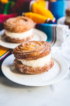 three pastries sitting on top of white plates