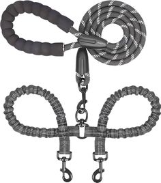 a black and white photo of two leashes with one rope attached to the other