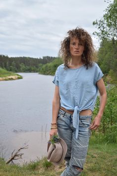 "Excellent denim blouse for your midsummer nights. It is not a mistake - buttons are on the back! Size: label says S, seems like women's (S) MEASUREMENTS: Length: 57 cm/ 22\" (without ties) Shoulder to shoulder: 50 cm/ 20\" Chest: 116 cm/ 46\" Condition: excellent Fabric: Lyocell Brand: unknown * Wash at temperature not higher than 30oC / 86oF Model wears: UK 8/ EU 36/ US 4 Model's height: 175 cm/5'7\" You can find more similar shirts here: https://www.etsy.com/shop/OnTheRoadStore?section_id=239 Summer Relaxed Fit Denim Blue Denim Top, Light Indigo Denim Top For Day Out, Casual Summer Denim Top With Relaxed Fit, Trendy Medium Wash Blouse For Summer, Relaxed Fit Denim Top For Day Out, Trendy Summer Denim Blouse, Trendy Denim Blouse For Day Out, Trendy Summer Denim Top For Day Out, Spring Relaxed Fit Denim Blue Blouse