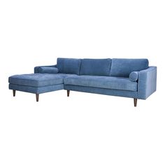 a blue sectional couch sitting on top of a white floor