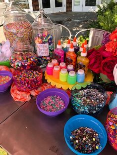 the table is covered with lots of colorful confetti and sprinkles