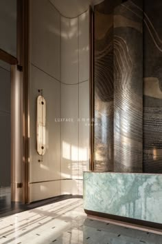 an elegant bathroom with marble floors and walls