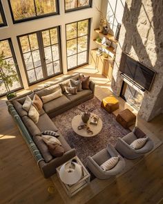 an aerial view of a living room with large windows