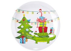 a glass ornament with a christmas tree and presents on it