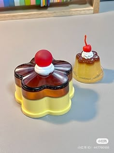 two small cakes sitting on top of a table