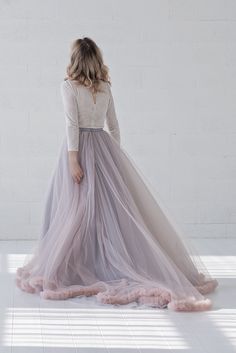 "Default features of this skirt: * It consists 4 tulle layers, fully lined in bridal satin. * Slightly gathered only the outermost layer, inner ones fully flart * Slim A line silhouette. * Non hand dyeable, but a vast color selection available. * Lining in half circle, wide and flowing. * Features a default train of 22\" or 55cm, can be shorter or none at all if requested. * Tailored satin waistband, 1\" or 2.5cm waistband by default, matches the inner layers of the skirt by default, but can als Bridal Separates Tops, Bridal Bodysuit, Bridal Skirt, Bridal Skirts, Blush And Grey, Dimensional Color, Bridal Tops, Wedding Skirt, Bridal Separates