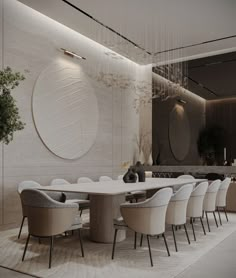 an elegant dining room with white chairs and a large round table surrounded by beige upholstered chairs