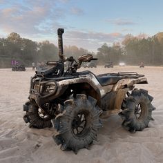 an atv that is sitting in the sand