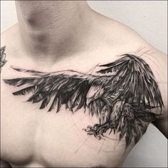 a man's chest with an eagle tattoo on it