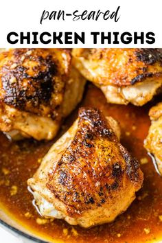 chicken thighs in a pan with sauce on top and the words, pan - fried chicken thighs