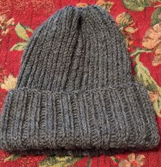 Ready to ship. A new hand knit beanie made from 100% wool. This hat measures 7 1/2 inches wide,  ,10 inches tall without the cuff  rolled up, 8 inches tall with the cuff rolled and stretches to ten inches wide. This is a warm and snug beanie that you can wear outside in the cold weather and not worry about being chilled. Gray One-size Beanie Cap, Gray Beanie Cap, Gray Knit Beanie Hat, Gray Knit Beanie For Cold Weather, Gray Soft Knit Beanie One Size, Gray Knitted Beanie Cap, Gray Crochet Beanie Hat, Warm Gray Bonnet Cap, Warm Gray Bonnet One Size Fits Most