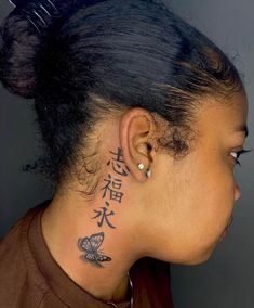 a woman with a tattoo on her neck