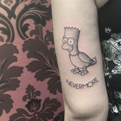 a woman's arm with a cartoon character tattoo on it that says nevermore