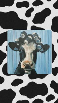 a painting of a cow's head with circles on its forehead and nose, in front of a black and white background