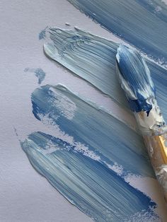 A few blue and white paint brush strokes with paint brush Health Wealth, Love Blue