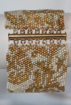 two gold and white beaded bracelets