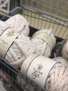 several balls of yarn are in a basket