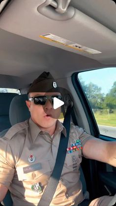 a man sitting in the back seat of a car