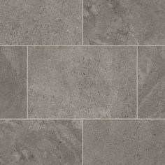 a gray tile floor with several different tiles