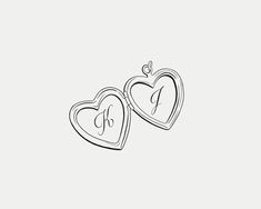 two heart shaped lockes with initials on them