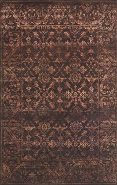 a brown rug with an intricate design on the top and bottom, it is shown