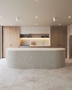 a large kitchen with an island counter next to a sliding glass door