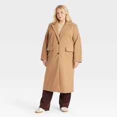 This Faux-Wool Pea Coat from A New Day™ offers a warm and classic look for brisk days. Made of midweight recycled polyester fabric with full lining, this faux-wool coat is designed with a notched collar, single-breasted front with buttons and long sleeves. It’s tailored in a casual, below-knee silhouette with a statement slit at the back, along with flap pockets on the front to complete the design with functional flair. A New Day™: Style that goes wherever you do. Recycled Polyester Fabric, Wool Peacoat, Pea Coat, Notched Collar, Top Coat, A New Day, Wool Coat, Classic Looks, Single Breasted