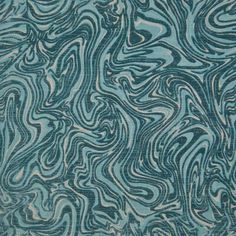 an abstract blue and white pattern on fabric