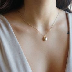 Tiny Locket Necklace, Dainty Vintage Necklace, Gold Oval Pendant Necklace With Clavicle Chain, Oval Drop Necklace For Anniversary, Elegant Locket Necklace With Delicate Chain For Anniversary, Delicate Oval Jewelry With Adjustable Chain, Dainty Oval Jewelry With Adjustable Chain, Minimalist Locket Necklace For Gift, Gold Oval Pendant Pearl Necklace