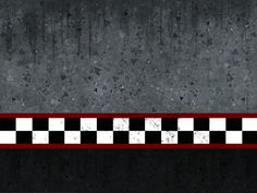 a black and white checkered wall with a red stripe in the middle is shown