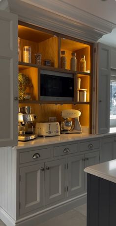 a kitchen with an oven, microwave and cabinets