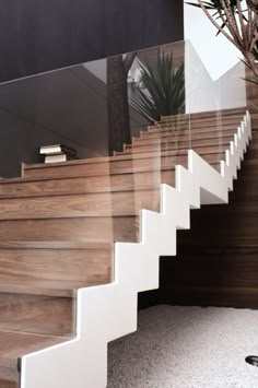 the stairs are made of wood and white