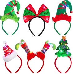 four christmas headbands with bows and lights on them, all decorated in different colors