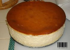 a cheesecake sitting on top of a white counter