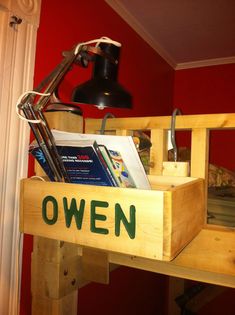 a wooden shelf with books and lamp on it