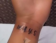 someone has written on their foot that says, mays