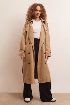 The Davis Trench Coat is a classic and perfect for transitional weather. A closet staple, she is made using a cotton/poly/nylon blend. Dart details at the back create shape and it has a self tie belt and functional pockets. Imported 45% Cotton 44% Polyester 11% Nylon Fits True to Size Lounge Bra, The Perfect Girl, Denim Shoes, Twill Fabric, Workwear Dress, S Models, Dart, Oversized Fits, Outerwear Jackets