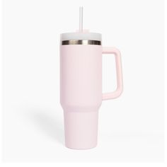 a pink travel mug with a straw sticking out of it