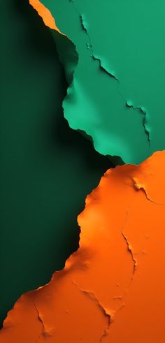 an orange and green background with cracks in it