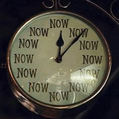 a clock with the words now and now written on it