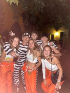 a group of people dressed in jail clothes