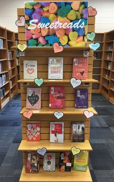 the shelves are filled with books and have hearts on them