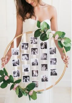 a woman is holding a wreath with photos on it and greenery around the frame