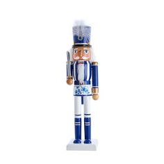 a blue and white nutcracker is standing