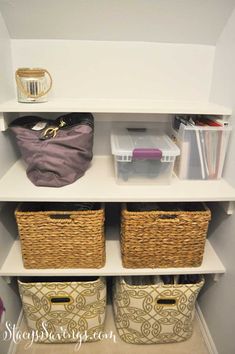 a white shelf filled with baskets and other items