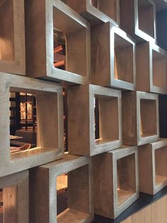 the shelves are made out of concrete blocks